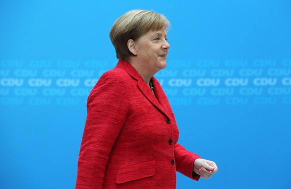 epa06581888 German Chancellor Angela Merkel leaves after her press statement at the Christian Democratic Union (CDU) headquarters in Berlin, Germany, 05 March 2018. Merkel commented on the voting resu ...