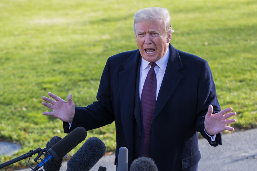 epa07180358 US President Donald J. Trump speaks to the news media before departing on Marine One with his family on the South Lawn of the White House in Washington, DC, USA, 20 November 2018. Trump is ...