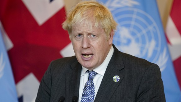 FILE - In this Monday, Sept. 20, 2021 file photo, British Prime Minister Boris Johnson speaks to reporters at United Nations headquarters. Johnson will on Tuesday, Sept. 28 finally meet with members o ...