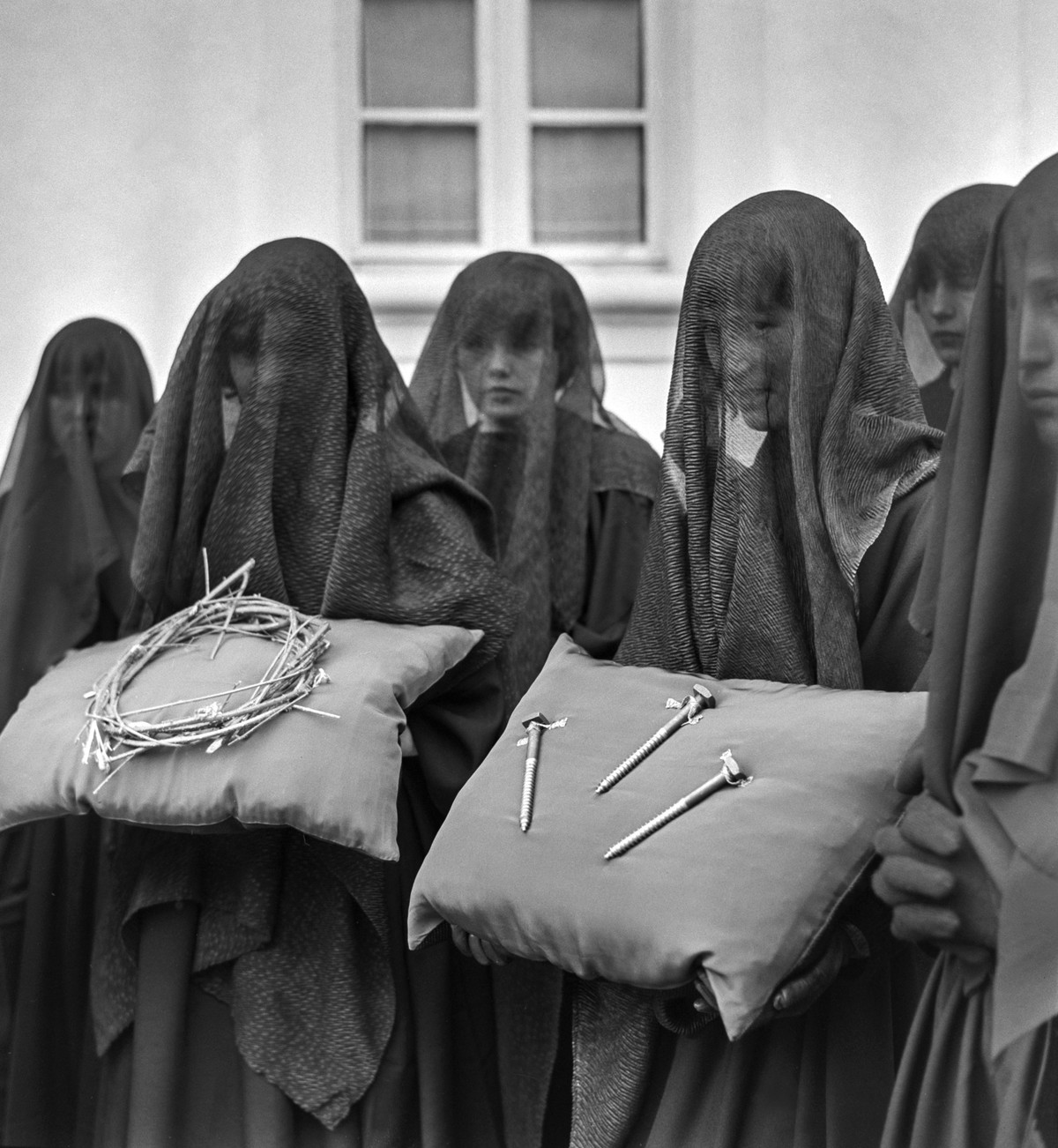 "Les Pleureuses", mourners, walk in the streets of Romont, Canton of Fribourg, Switzerland, on April 9, 1971. According to Good Friday liturgy, cross-bearers dressed in black frocks and veil ...