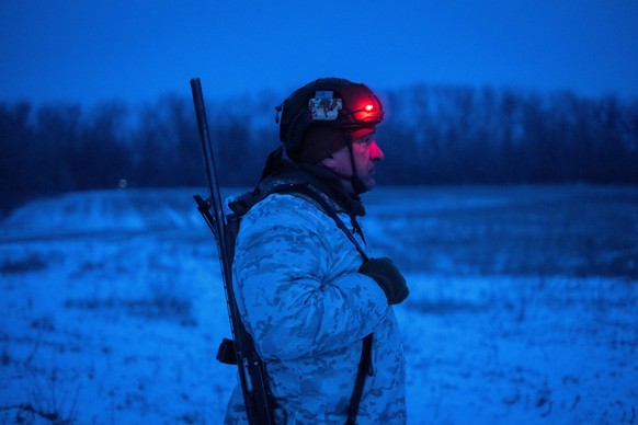 In this photo provided by Ukraine's 93rd Kholodnyi Yar Separate Mechanized Brigade press service, a soldier is seen on his position at the frontline in the Druzhkivka direction, Donetsk region, U ...