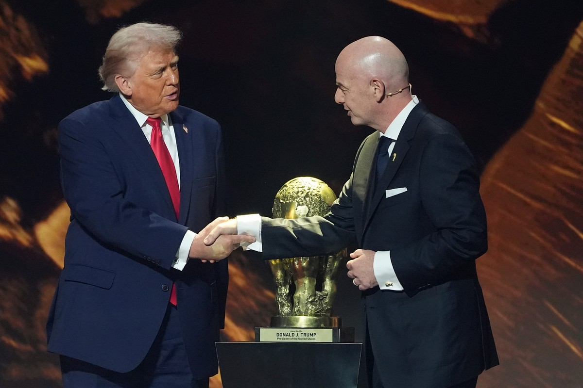 FILE - President Donald Trump shakes hands with FIFA President Gianni Infantino as he presented with the inaugural FIFA Peace Prize during the 2026 FIFA World Cup draw at the Kennedy Center, Dec. 5, 2 ...