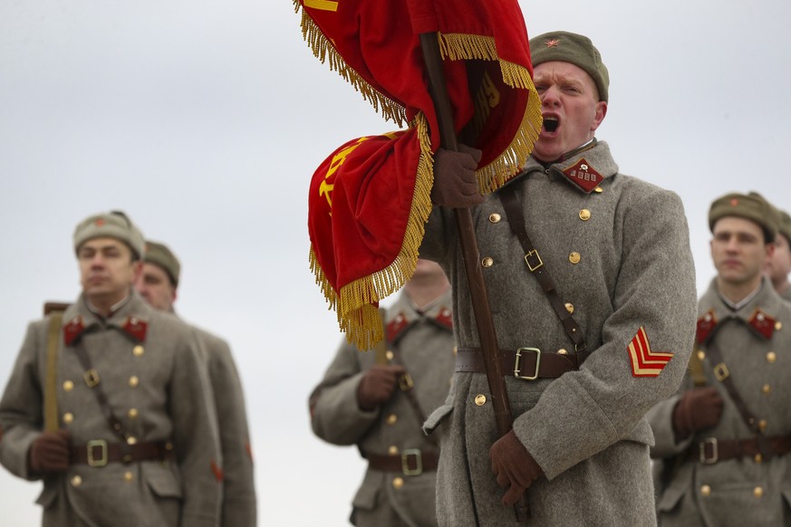 Russian historical reenactors dressed in Red Army uniform participate in a World War II battle with Nazi German soldiers, marking the 81st anniversary of the Soviet victory in the battle of Stalingrad ...