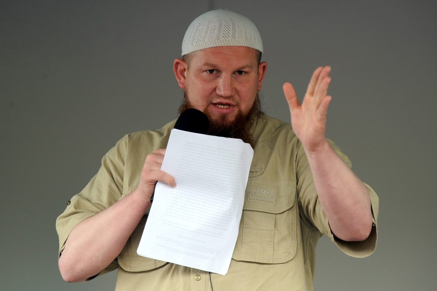 epa04235449 Controversial Salafist preacher Pierre Vogel speaks in front of the train station in Bremen, Germany, 01 June 2014. Bremen city council banned the event, but they were forced to allow it a ...