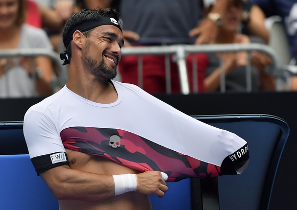 Italy&#039;s Fabio Fognini changes his shirt during his third round match against France&#039;s Julien Benneteau at the Australian Open tennis championships in Melbourne, Australia, Saturday, Jan. 20, ...