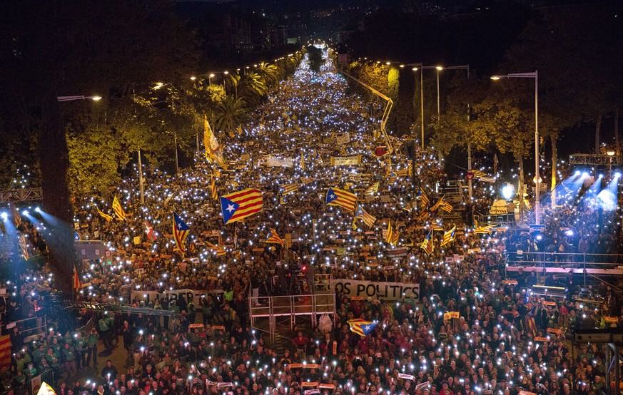 Demonstrators gather during a protest calling for the release of Catalan jailed politicians, in Barcelona, Spain, on Saturday, Nov 11, 2017. Eight members of the now-defunct Catalan government remain  ...