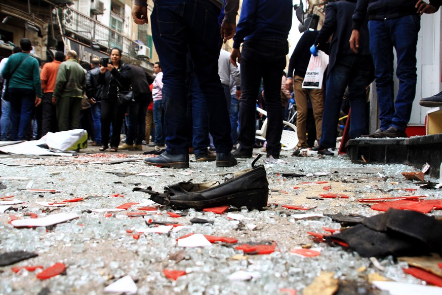 epa05899543 Security personnel investigate the scene of a bomb explosion outside the Saint Mark&#039;s coptic Cathedral in Alexandria, 250km northwest of Cairo, Egypt, 09 April 2017. According to the  ...