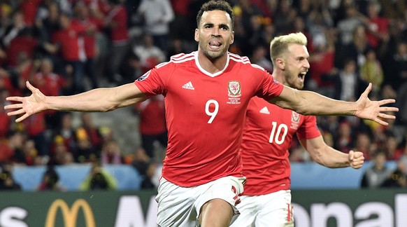 Wales&#039; Hal Robson Kanu, left, celebrates after scoring his sides second goal during the Euro 2016 quarterfinal soccer match between Wales and Belgium, at the Pierre Mauroy stadium in Villeneuve  ...