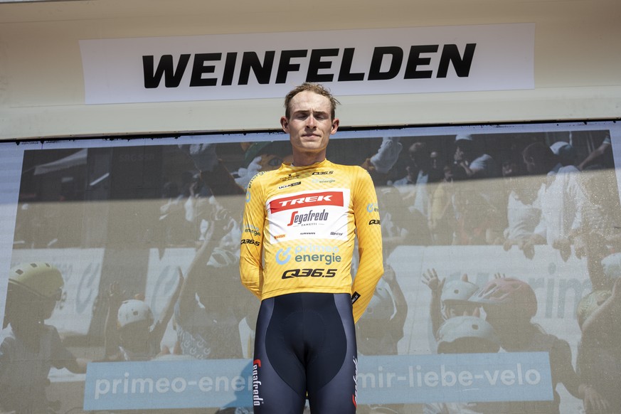 Mattias Skjelmose from Denmark of Trek-Segafredo reacts in the yellow leader jersey in commemoration of Gino Maeder of Switzerland who passed away yesterday after crashing, during the seventh stage, a ...