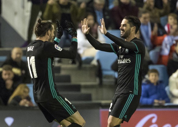 Real Madrid&#039;s Gareth Bale and teammate Francisco Román &quot;Isco&quot; celebrate after scoring the second goal against Celta during a Spanish La Liga soccer match between RC Celta and Real Madri ...