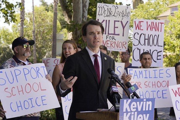 Assemblyman Kevin Kiley, of Rocklin, a Republican candidate for governor in the Sept. 14 recall election, campaigns for school choice outside a charter school in Sacramento, Calif., Wednesday, July 21 ...