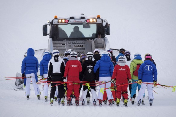 Racers are towed up the hill by a snow cat after a power failure forced the delay in the women&#039;s World Cup downhill race in Lake Louise, Alberta, on Saturday, Dec. 2, 2017. (Jeff McIntosh/The Can ...