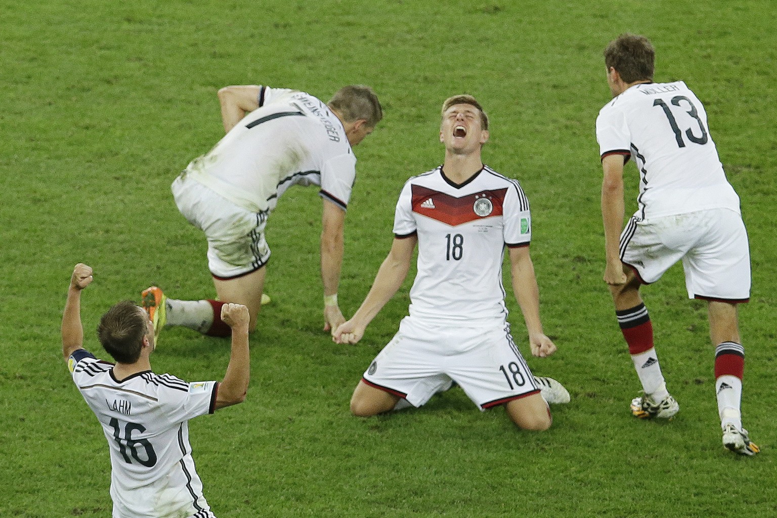 FILE - Germany&#039;s Toni Kroos, centre, reacts as Germany&#039;s players celebrate after winning on extra time at the World Cup final soccer match between Germany and Argentina at the Maracana Stadi ...