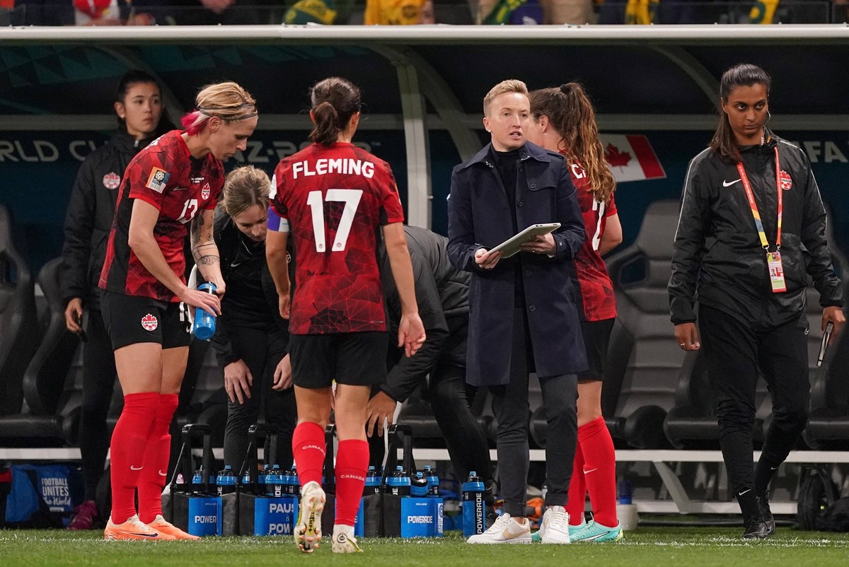 July 31, 2023, Melbourne, Australia: Canada coach Bev Priestman speaks to her players during a break in second half Group B soccer action against Australia at the FIFA Women s World Cup in Melbourne,  ...