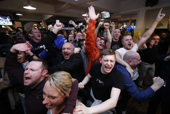 Britain Football Soccer - Leicester City fans watch the Chelsea v Tottenham Hotspur game in pub in Leicester - 2/5/16
Leicester City fans celebrate Chelsea&#039;s second goal
Reuters / Eddie Keogh
 ...