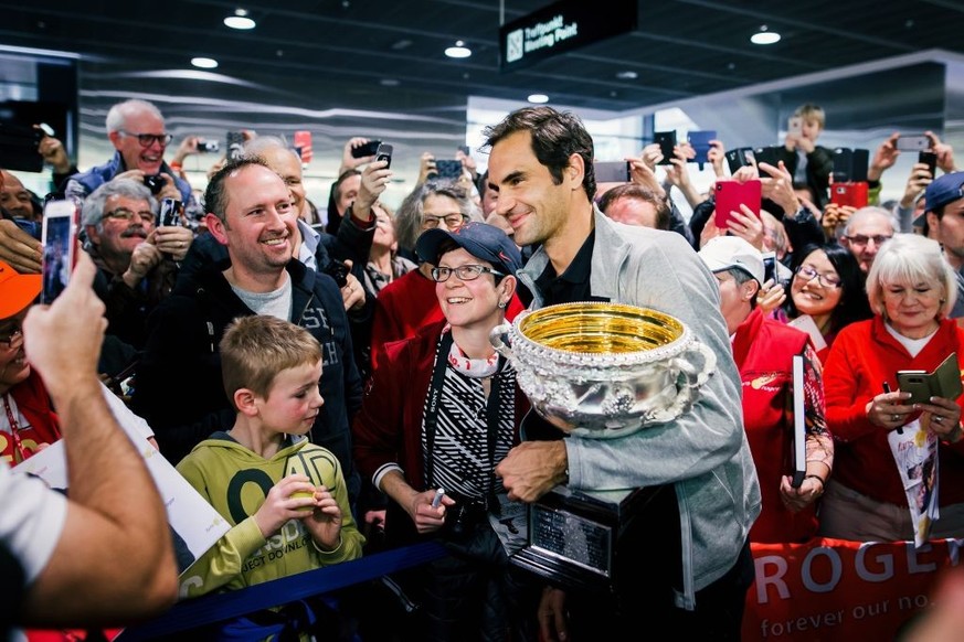 ZURICH, SWITZERLAND - JANUARY 30: Roger Federer arrives at Airport Kloten with his trophy after winning the 2018 Australian Open Men&#039;s Singles Final on January 30, 2018 in Zurich, Switzerland. (P ...