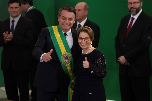 epa07257595 Brazilian newly inaugurated President Jair Bolsonaro (C-L) welcomes new Brazilian Minister of Agriculture Tereza Cristina (C-R), during his inauguration ceremony at the Planalto Palace in  ...