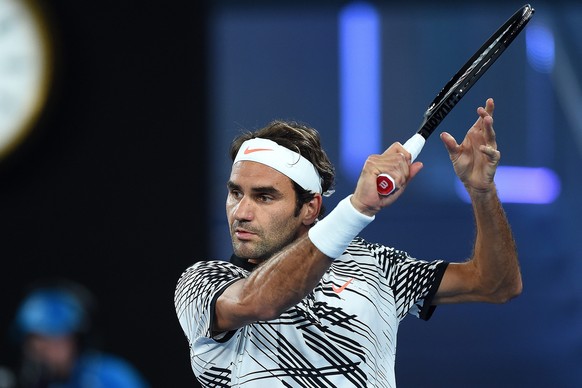 epa05721387 Roger Federer of Switzerland in action against Jurgen Melzer of Austria during their Men&#039;s Singles first round match of the Australian Open Grand Slam tennis tournament in Melbourne,  ...