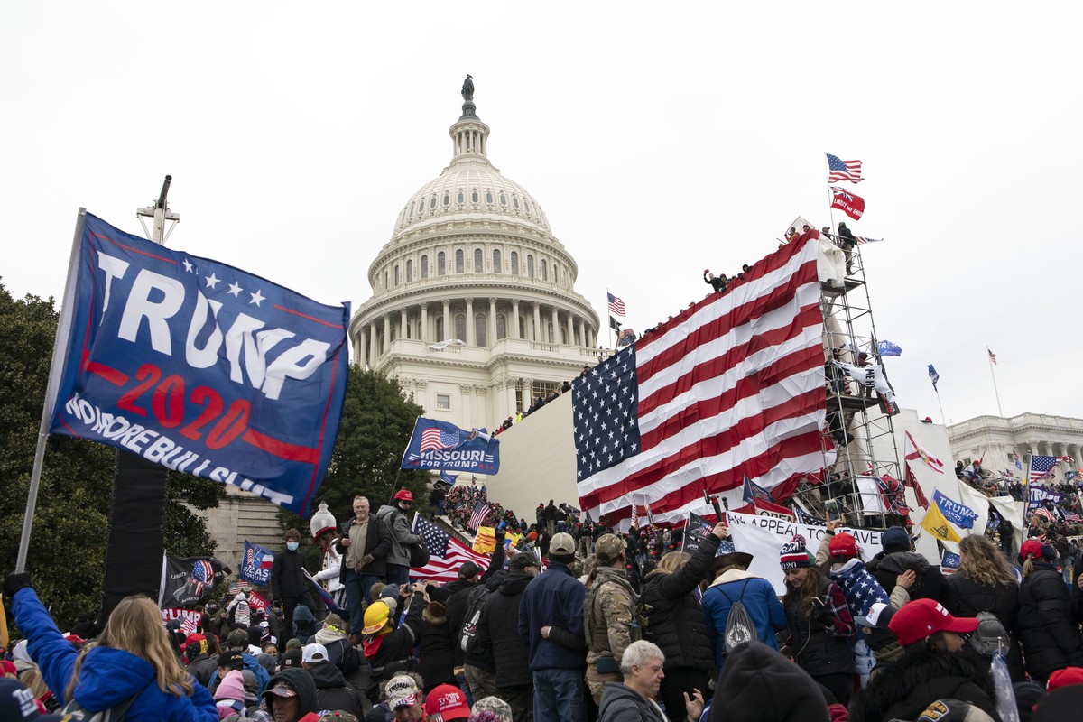 FILE - In this Jan. 6, 2021, file photo, supporters of President Donald Trump stand outside the U.S. Capitol in Washington. Black activists are coming out strongly against a growing narrative among co ...