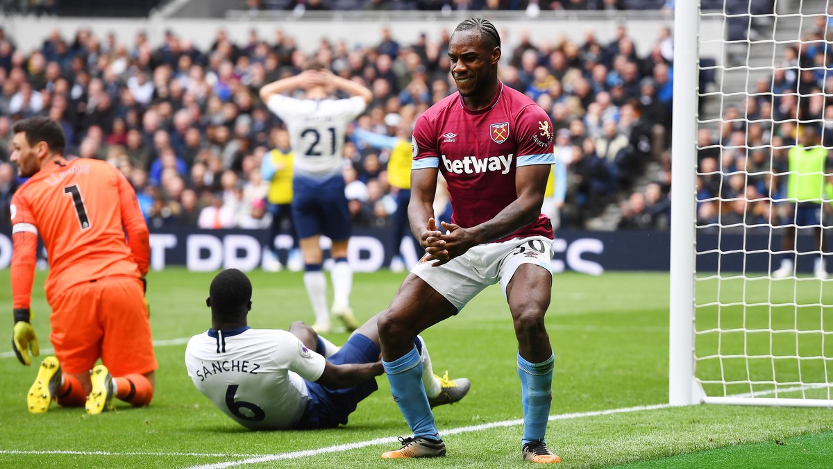 epa07531924 West Ham's Michail Antonio (R) celebrates after scoring the 1-0 lead during the English Premier League soccer match between Tottenham Hotspur and West Ham United at the Tottenham Hots ...