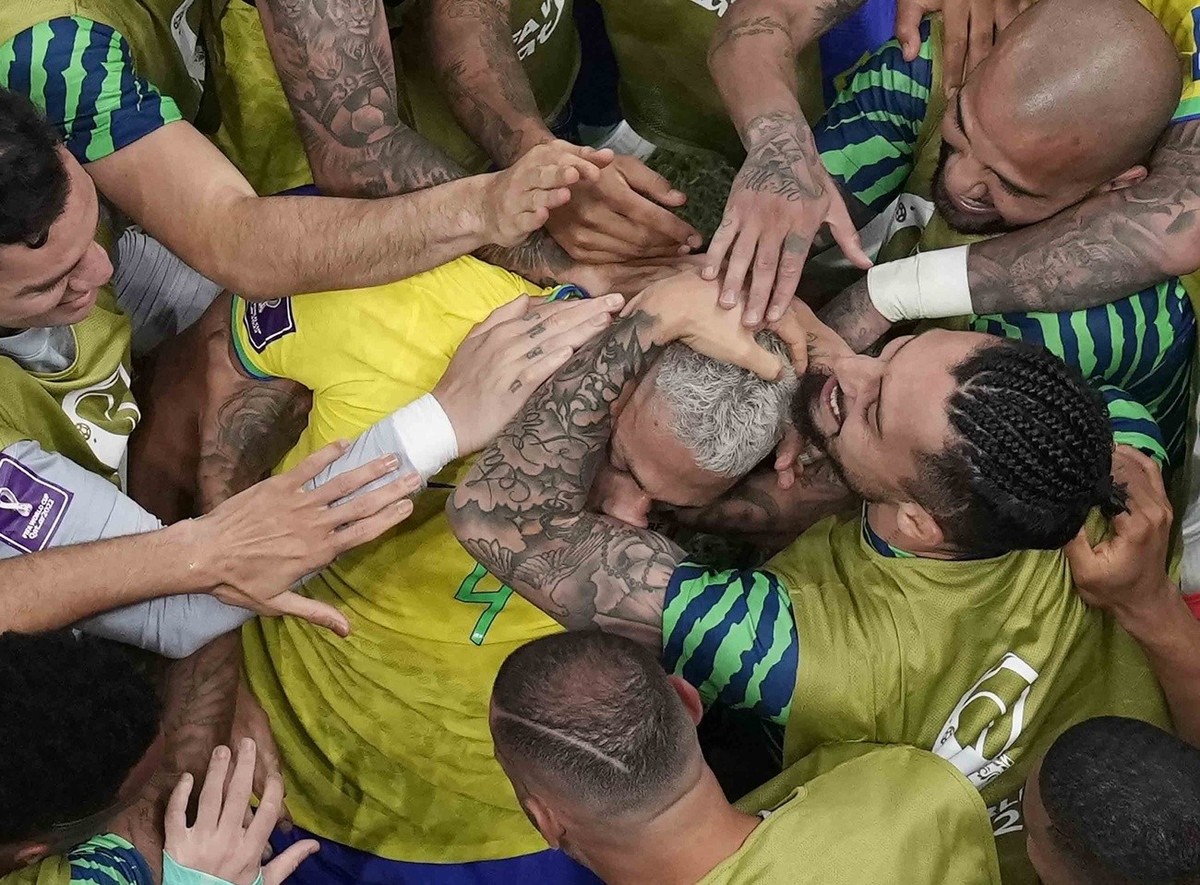 Teammates celebrate with Brazil's Richarlison after he scored his second goal during the World Cup group G soccer match between Brazil and Serbia, at the Lusail Stadium in Lusail, Qatar, Thursday ...