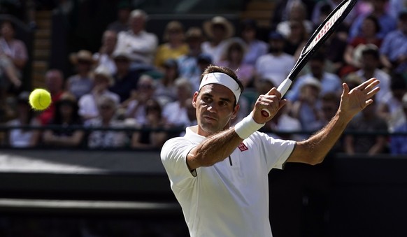 epa07694807 Roger Federer of Switzerland returns to Jay Clarke of Britain in their second round match during the Wimbledon Championships at the All England Lawn Tennis Club, in London, Britain, 04 Jul ...