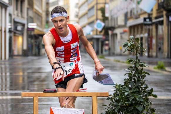 Matthias Kyburz of Switzerland in action during the men's sprint final race at the European Orienteering Championships in Neuchatel, Switzerland, Sunday, May 16, 2021. (KEYSTONE/Jean-Christophe Bott)
