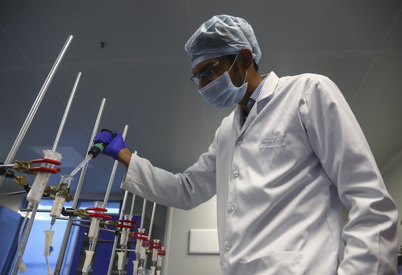 A scientist works at a lab of Huwel Lifesciences that manufactures COVID-19 test kits in Hyderabad, India on Oct. 7, 2021. The Government of India, with funding from The Rockefeller Foundation, tasked ...