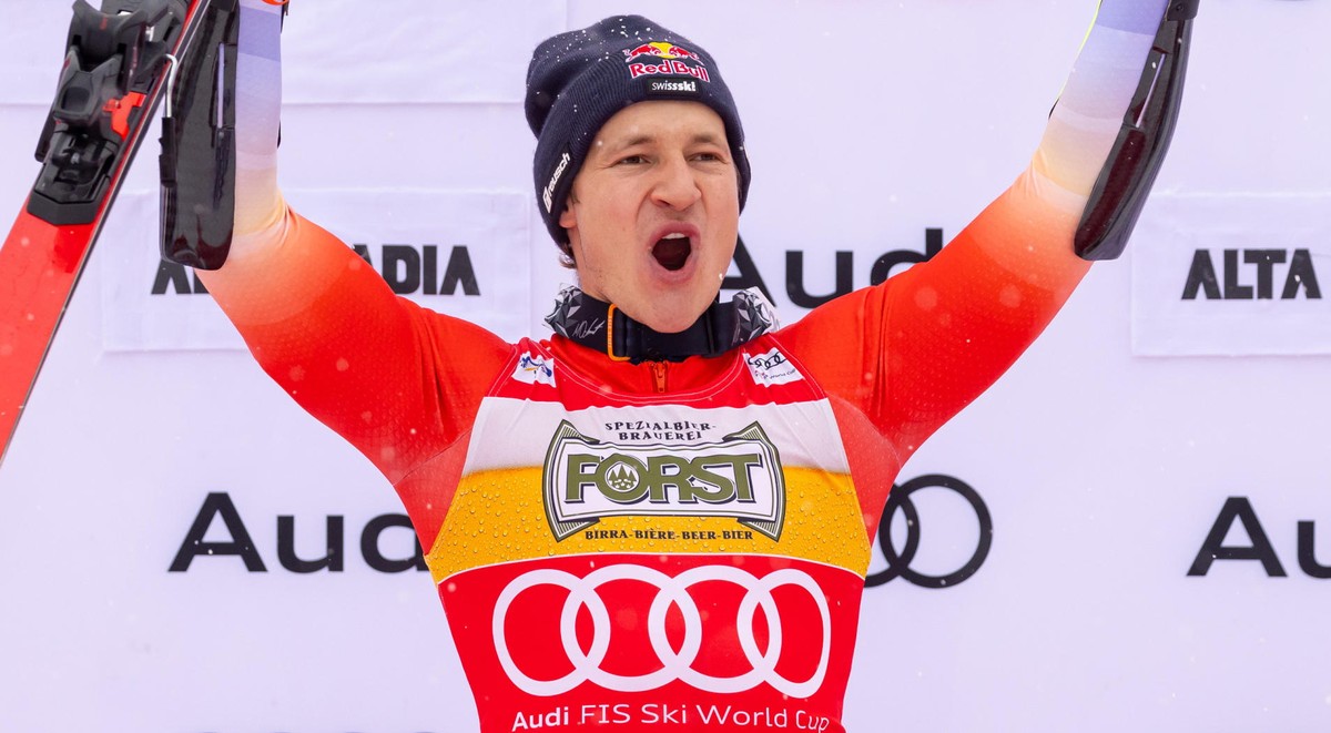 epa11789809 Winner Marco Odermatt of Switzerland celebrates on the podium after the Men's Giant Slalom race at the FIS Alpine Skiing World Cup event in Alta Badia, Italy, 22 December 2024. EPA/AN ...