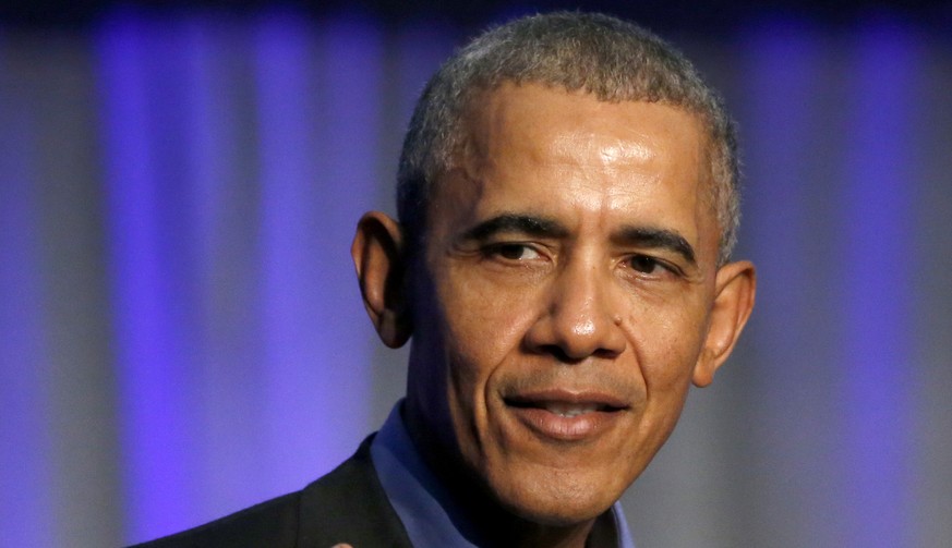 FILE- In this Dec. 5, 2017, file photo, former President Barack Obama address the participants at a summit on climate change involving mayors from around the globe in Chicago. Obama and his wife, Mich ...