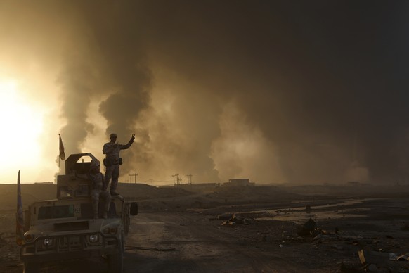 Smoke rises from Islamic state positions after an airstrike by coalition forces in Mosul, Iraq, Tuesday, Oct. 18, 2016. The pace of operations slowed on Tuesday as Iraqi forces began pushing toward la ...