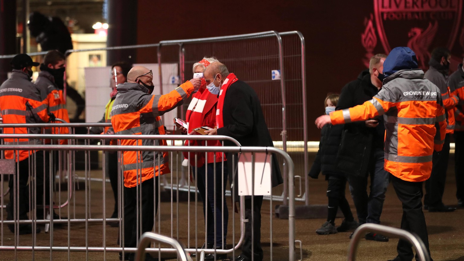 201207 -- LIVERPOOL, Dec. 7, 2020 -- Liverpool s supporters react before the English Premier League match between Liverpool FC and Wolverhampton Wanderers FC in Liverpool, Britain, on Dec. 6, 2020. FO ...