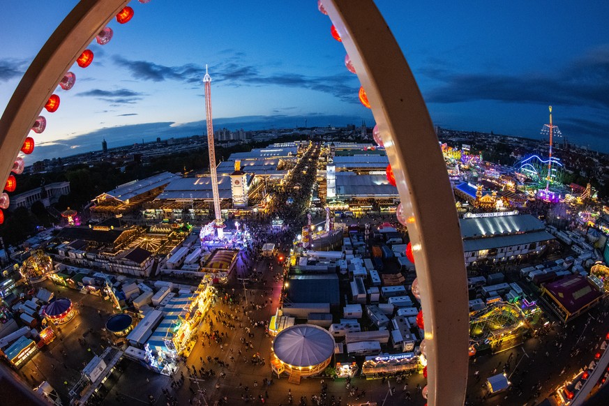 epa10190459 A picture taken with a fisheye lens shows a general view on beer tents and crowds during the 187th edition of the traditional Oktoberfest beer and amusement festival in the German Bavaria  ...