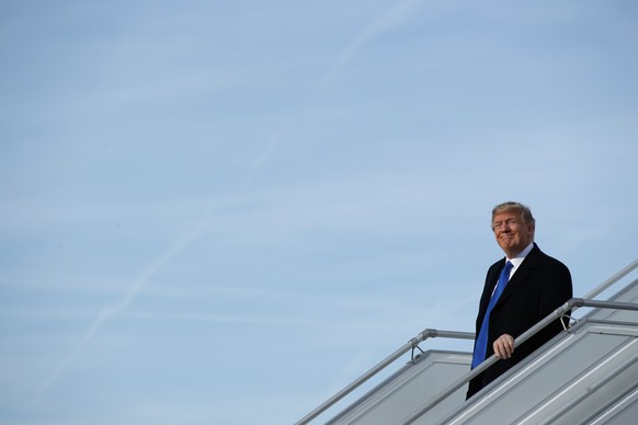 U.S. President Donald Trump alights from Air Force One at Zurich International Airport for the Davos World Economic Forum, Thursday, Jan. 25, 2018, in Zurich, Switzerland. Trump is attending the annua ...