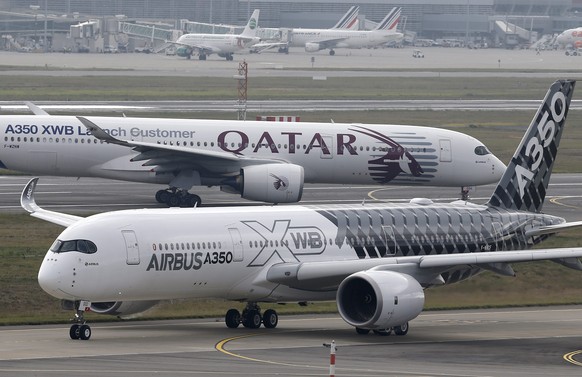 epa04524083 (FILE) An Airbus A350XWB aircraft (front) prepares to take off during a test flight from the Airbus headquarters in Blagnac, Southern France, 29 September 2014. The planned handover of Air ...