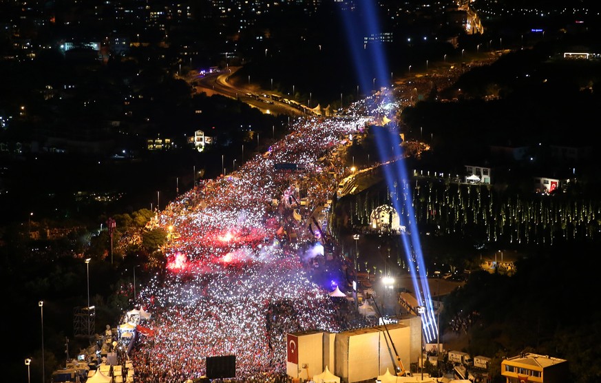 epa06090093 A handout picture provided by Presidental Press Office shows thousands of people gather for a rally to mark the first anniversary of the failed coup attempt on Bosphorus Bridge in Istanbul ...