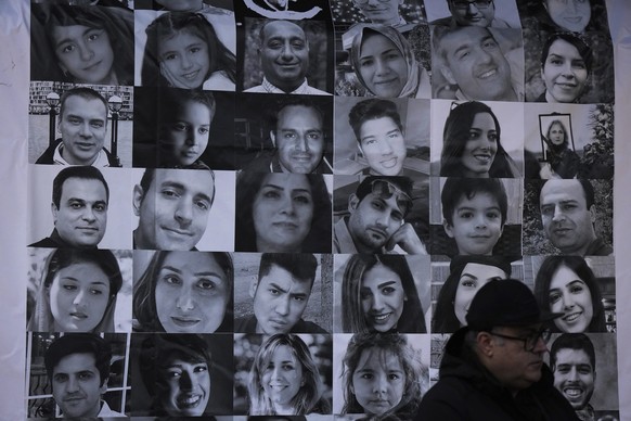 Photographs of victims of Flight PS752 are seen as thousands of people attend a rally to mark the National Day of Remembrance for Victims of Air Disasters, on the three year anniversary since the Iran ...