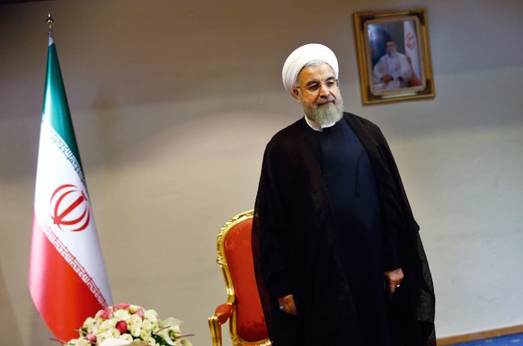 epa04828238 Iranian President, Hassan Rowhani, waits to start his meeting with the International Atomic Energy Agency (IAEA) chief, Yukiya Amano (not pictured), in Tehran, Iran, 02 July 2015. Media re ...