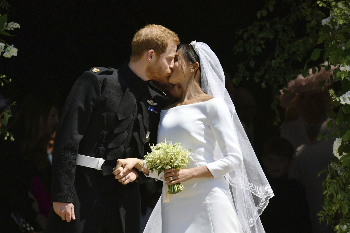 FILE - In this Saturday, May 19, 2018 file photo, Britain's Prince Harry and Meghan Markle leave after their wedding ceremony at St. George's Chapel in Windsor Castle in Windsor, near London ...