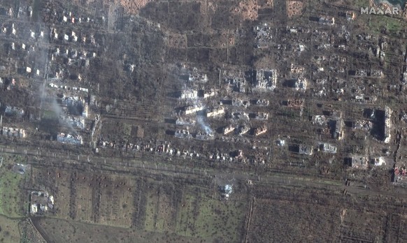 This satellite image provided by Maxar Technologies shows destroyed apartment buildings and craters in the southern part of the city of Bakhmut, Ukraine, Wednesday Jan. 4, 2023. (Satellite image �2022 ...