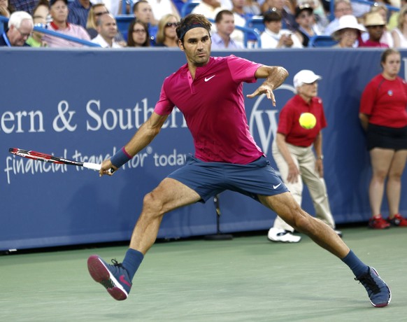 Roger Federer, of Switzerland, readies to hit a forehand to Feliciano Lopez, of Spain, during a quarterfinal at the Western &amp; Southern Open tennis tournament, Friday, Aug. 21, 2015, in Mason, Ohio ...