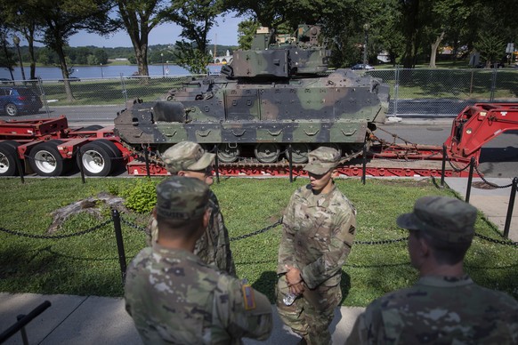 epa07692282 US Army soldiers stand watch at an armored Bradley Fighting Vehicle near the Lincoln Memorial as preparations continue for the US Independence Day celebrations on the National Mall in Wash ...