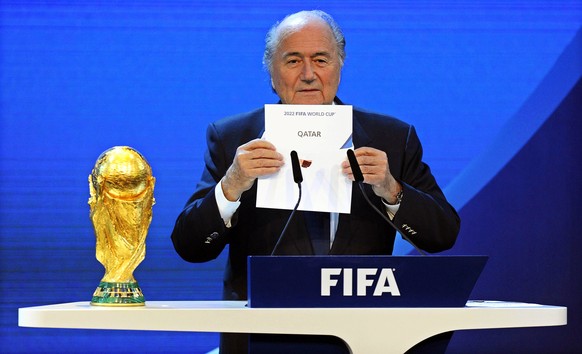 epa06052570 (FILE) - FIFA President Joseph Blatter announces that Qatar would be hosting the 2022 Soccer World Cup during the FIFA 2018 and 2022 World Cup Bid announcement in Zurich, Switzerland, 02 D ...