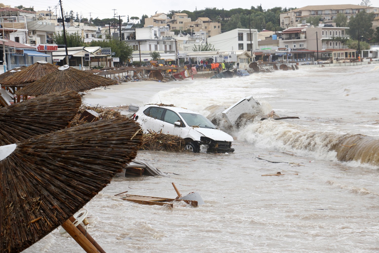 epa10245260 A car has been swept into the sea by floods at Aghia Pelagia, Heraklion, Crete island, Greece, 15 October 2022. A 50-year-old man was found dead at Aghia Pelagia, in the municipality of Ma ...