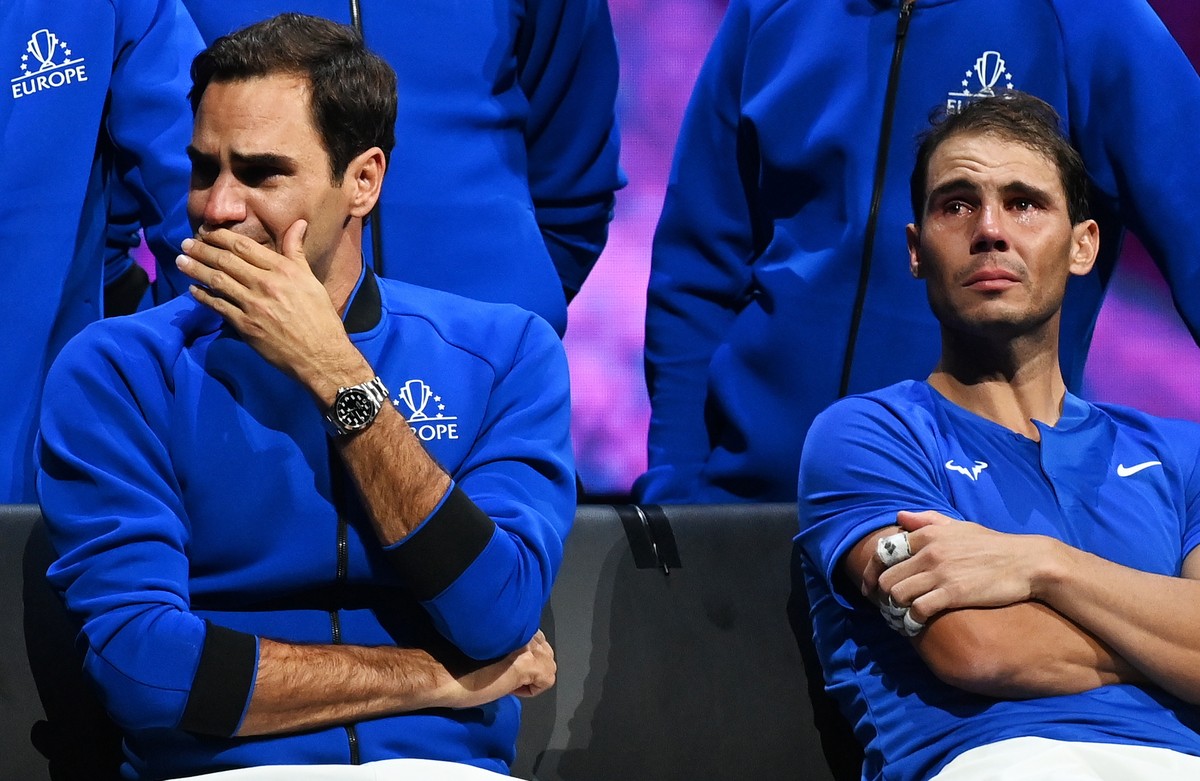 epa11652293 (FILE) - Team Europe player Roger Federer (L) of Switzerland sitting next to doubles partner Rafael Nadal of Spain after losing their match against Team World double Jack Sock of the US an ...