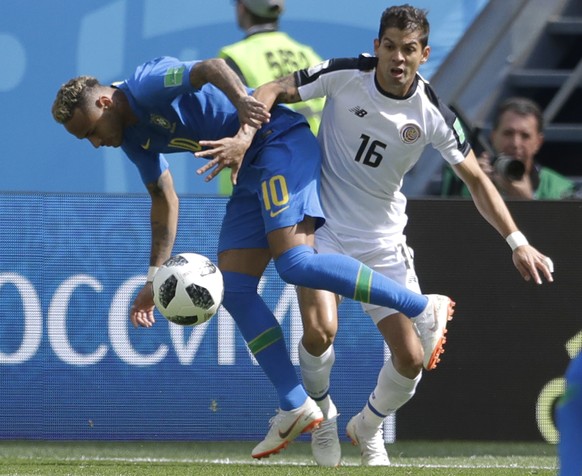 Brazil&#039;s Neymar, left, challenges for the ball with Costa Rica&#039;s Cristian Gamboa, during the group E match between Brazil and Costa Rica at the 2018 soccer World Cup in the St. Petersburg St ...