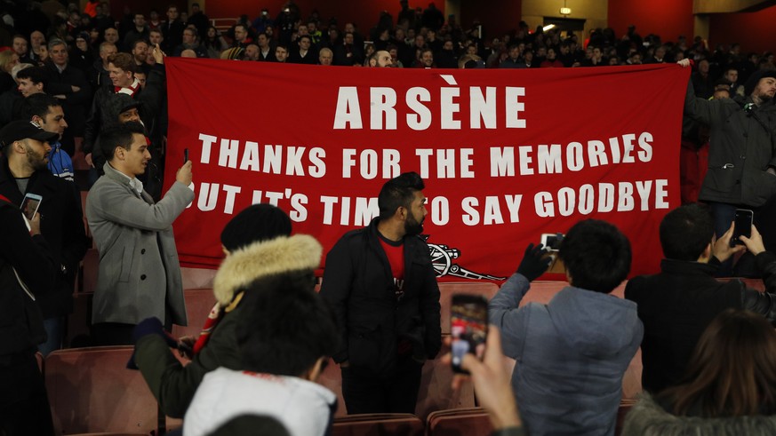 Britain Football Soccer - Arsenal v Bayern Munich - UEFA Champions League Round of 16 Second Leg - Emirates Stadium, London, England - 7/3/17 Arsenal fans hold up a banner protesting against Arsenal m ...