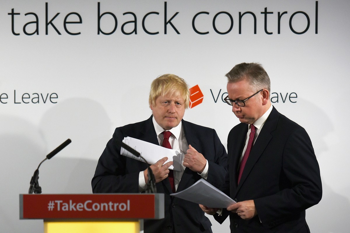 epa06820597 (FILE) - Michael Gove (R) and Boris Johnson (L) swap places as they address the media after their Vote Leave campaign won the United Kingdom's EU referendum, in London, Britain, 24 Ju ...