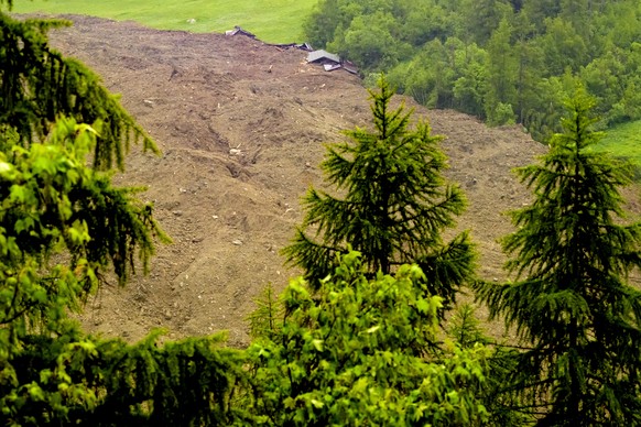 A large avalanche with a mixture of ice, rock, snow and water reach the valley floor is pictured in Wiler after the Birch glacier collapsing above Blatten, Switzerland, Wednesday, May 28, 2025. (KEYST ...