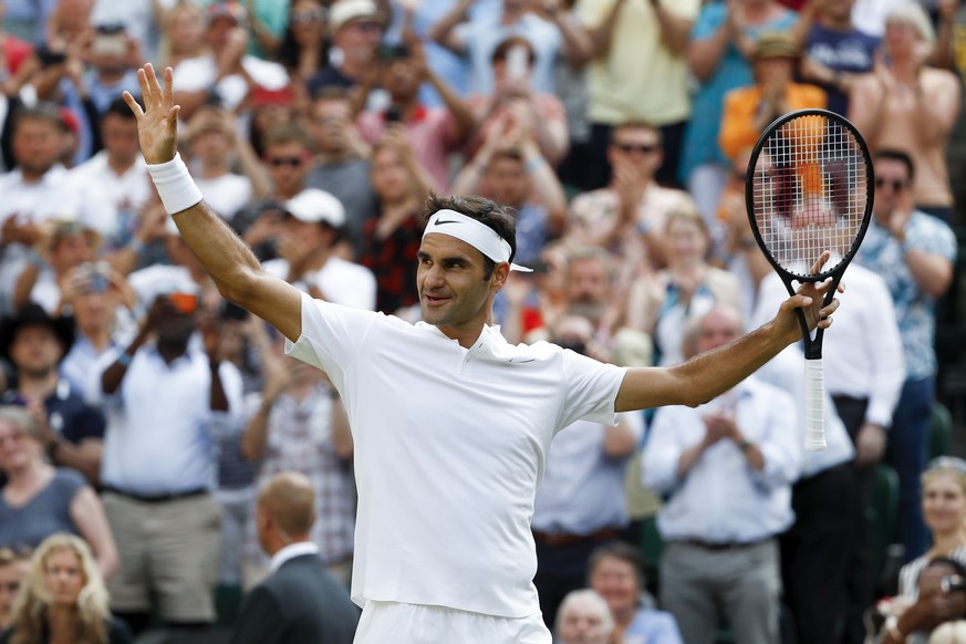 Roger Federer of Switzerland celebrates after beating Grigor Dimitrov of Bulgaria in their Men&#039;s Singles match, at the Wimbledon Championships at the All England Lawn Tennis Club, in London, Brit ...